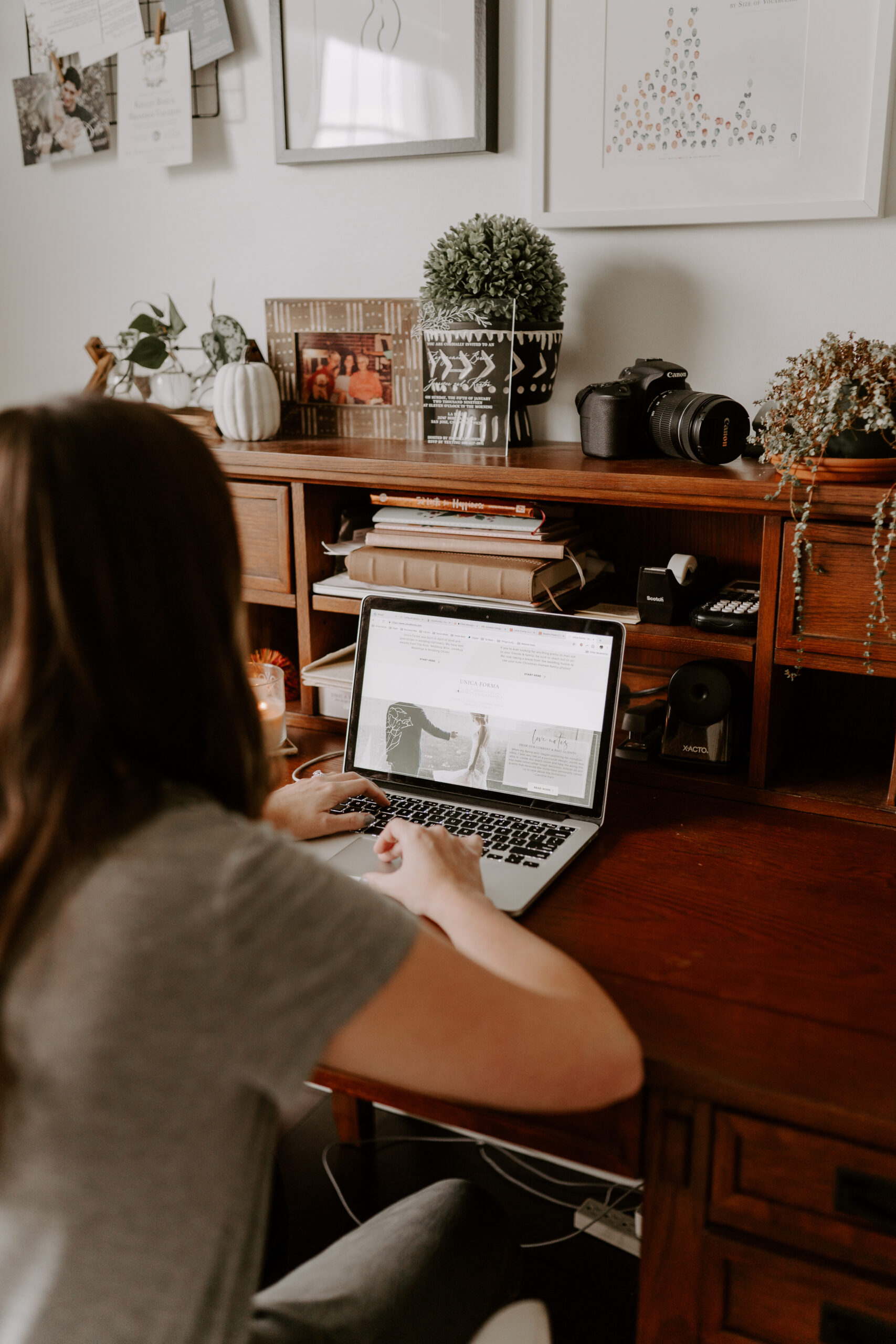 Person working on a MacBook to update DNS settings for a seamless DNS transfer to Showit, ensuring a smooth website transition.