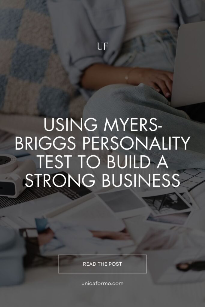 Woman working on a laptop with mood board photos laid out, reflecting the use of Myers-Briggs personality test in business.