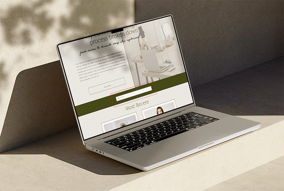 Macbook showcasing a Showit website's search bar
