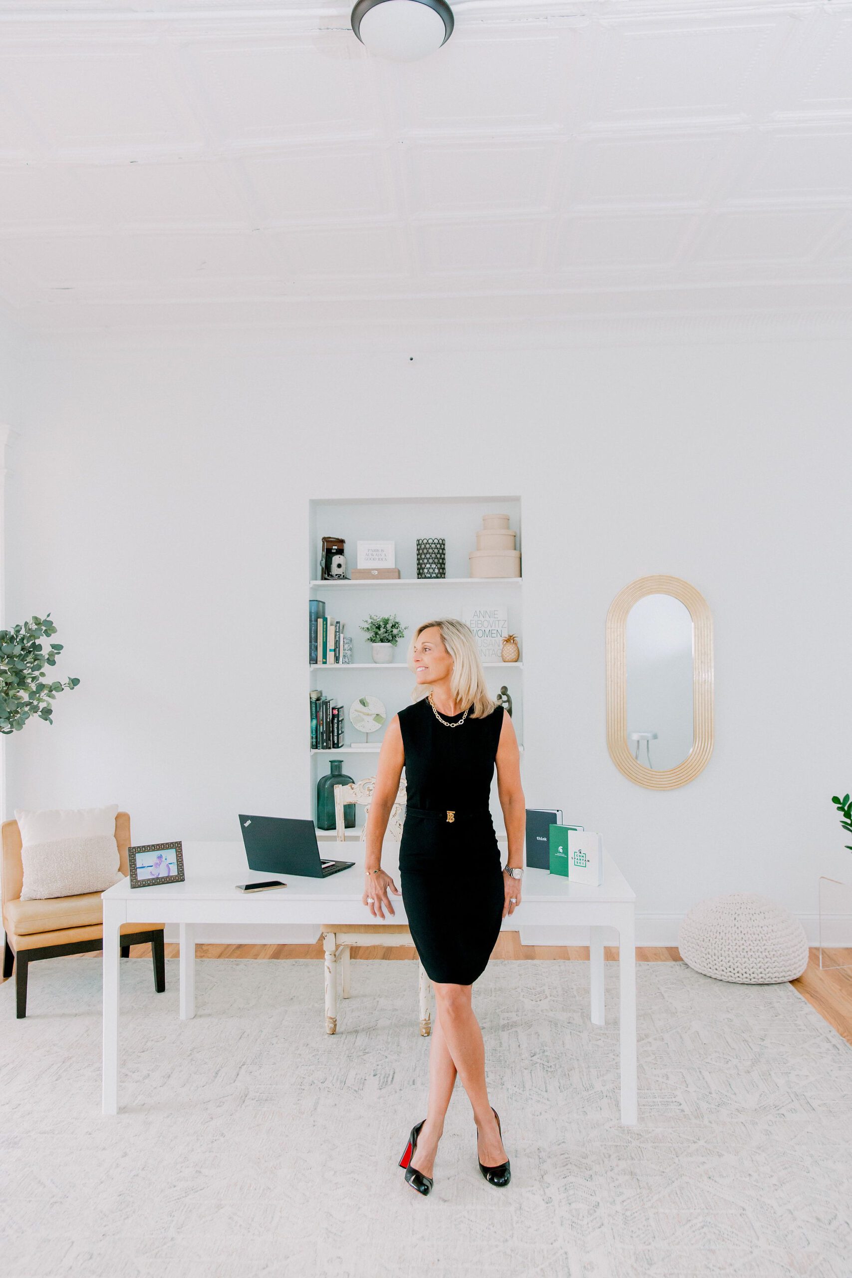 woman standing in front her desk for brand photography