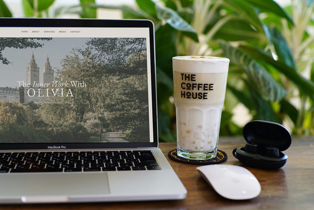What makes a Showit website different — designer at work at a coffee shop
