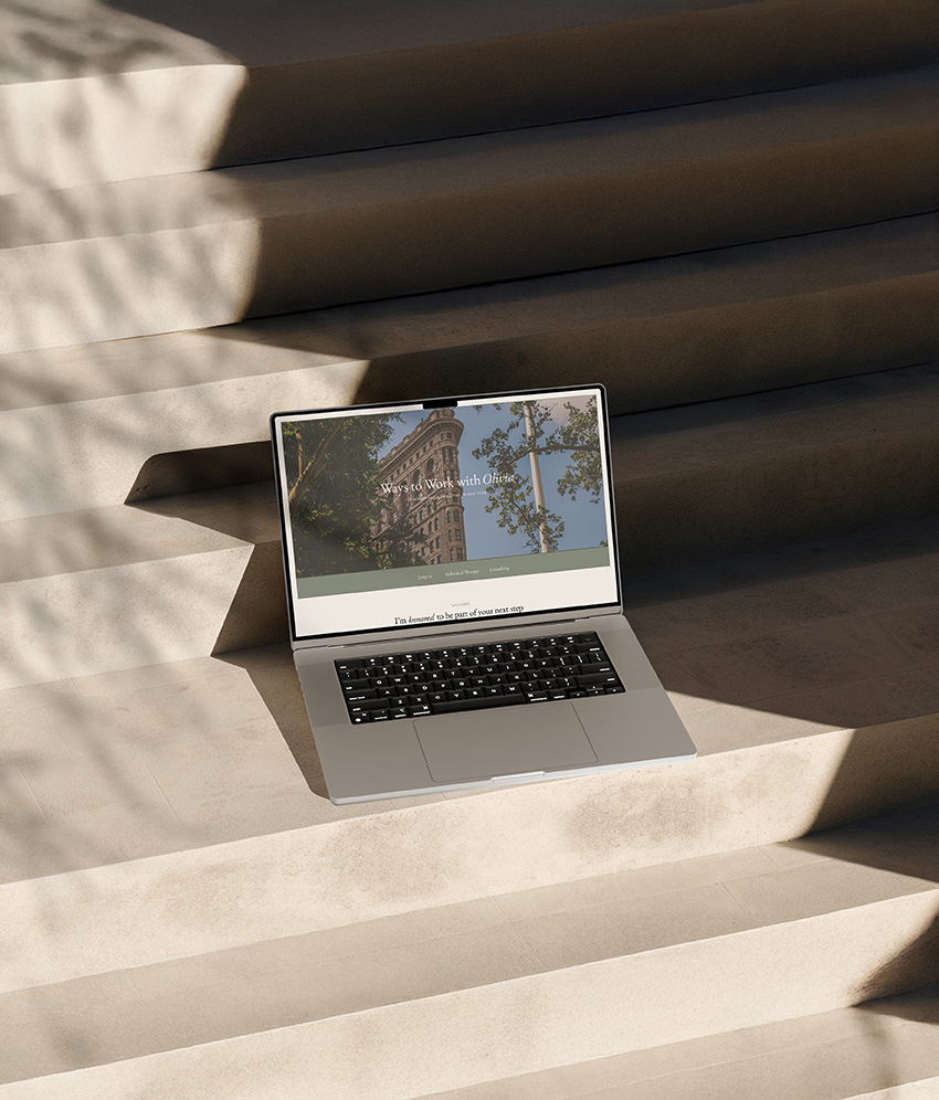 A sophisticated therapist web design shown on a macbook pro.