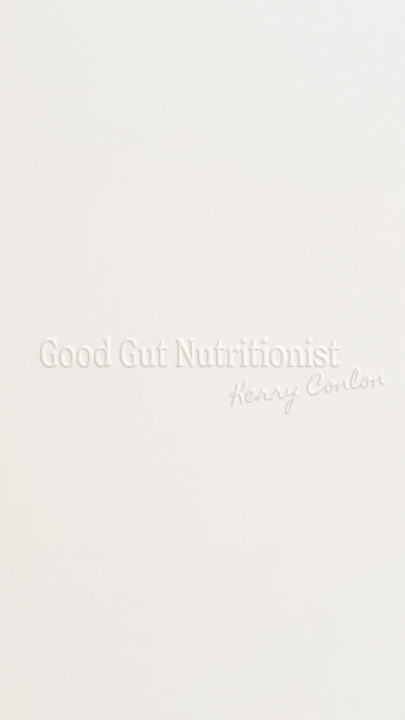 Minimalist off-white graphic with raised white lettering reading “Good Gut Nutritionist” and “Healthy Color,” conveying a soft, clean, calming tone.