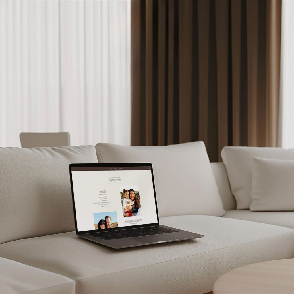An open laptop on a light gray sofa displays a video-call interface with people on screen; a calm, minimalist living room sets a quiet, modern tone.