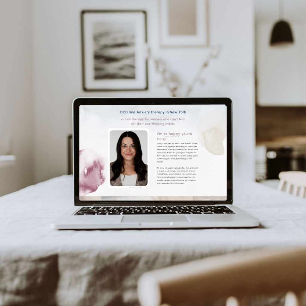 Laptop on a neatly made bed displays an OCD and anxiety therapy webpage in New York, featuring a woman’s portrait and a welcoming, professional tone.