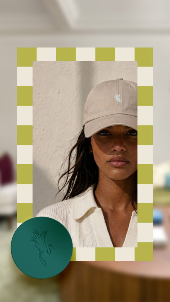 Portrait of a woman in a beige cap and cream shirt, framed by a green-and-white checkerboard border; calm, stylish tone with a bird emblem.