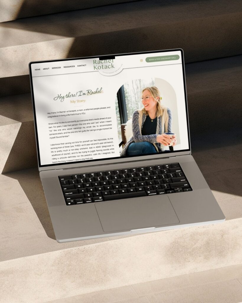 Laptop on a sunlit sofa displays Rachel Kotack’s personal website, featuring her portrait and biography in a warm, polished layout.